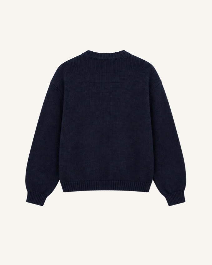 Merino Knit, back: plain navy with a ribbed collar, cuffs and hem.